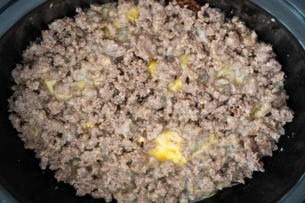 egg over ground sausage in slow cooker