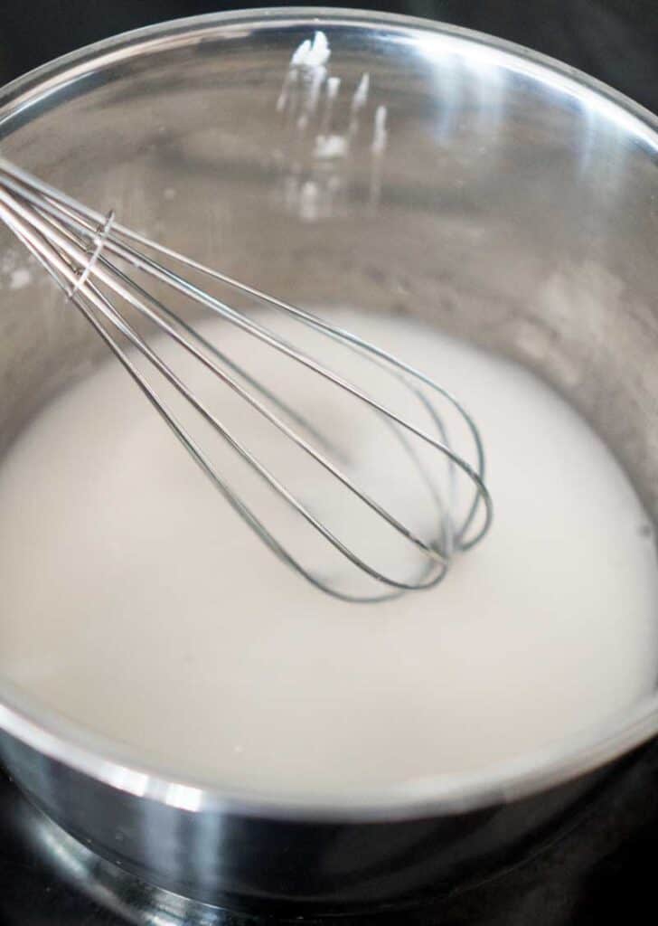 whisking lemon curd ingredients