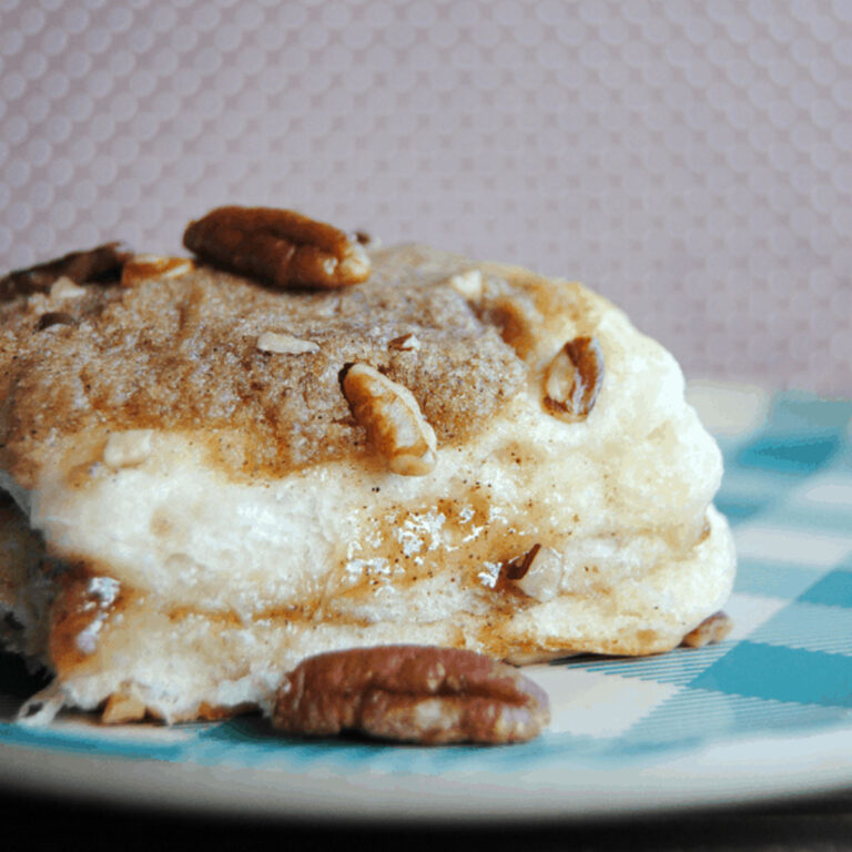 cinnamon roll biscuit on blue checked plate