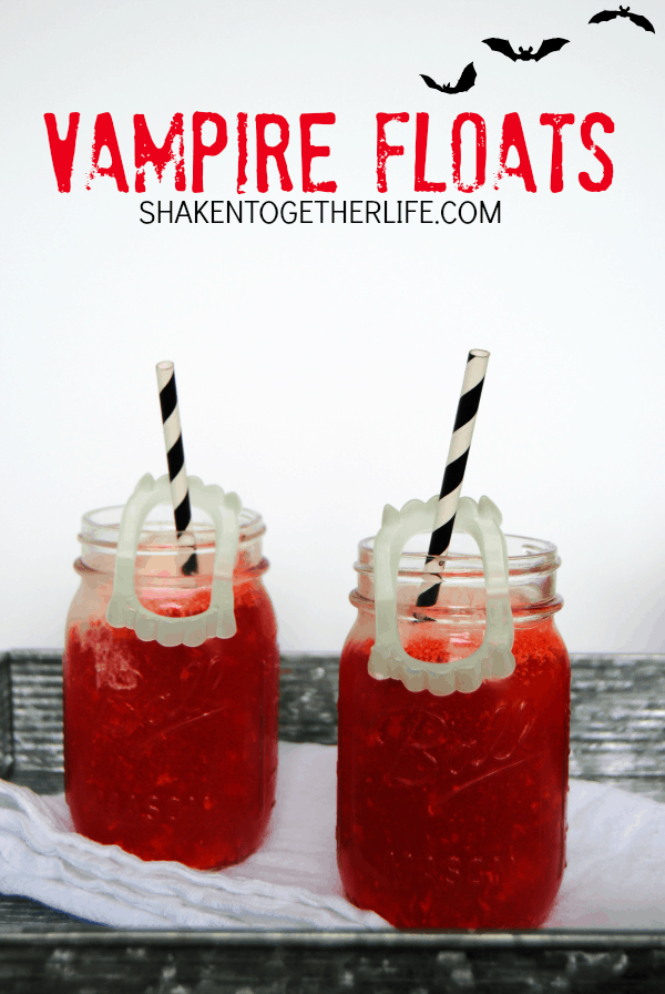 2 Vampire ice cream Floats with black and white straws and fake vampire teeth
