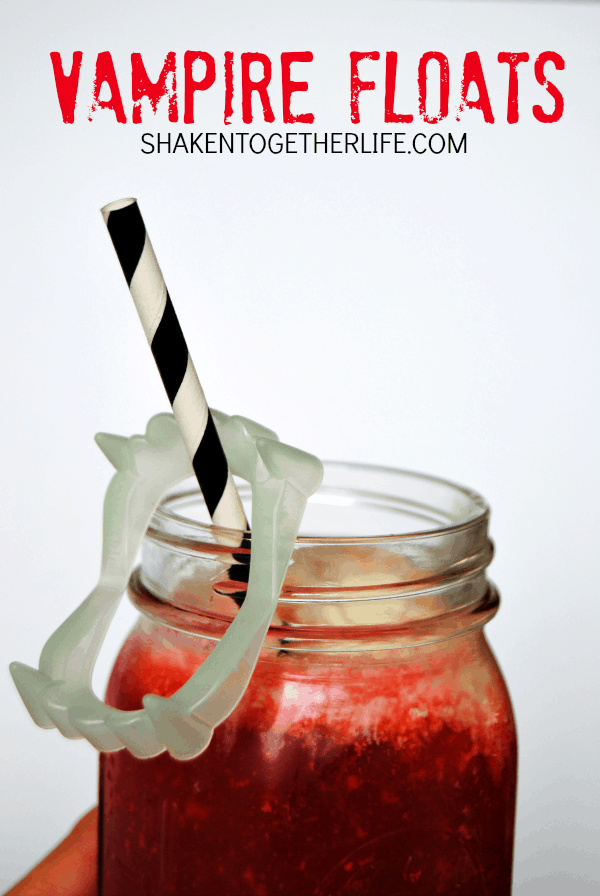 close up of a Vampire ice cream Float with black and white straws and fake vampire teeth