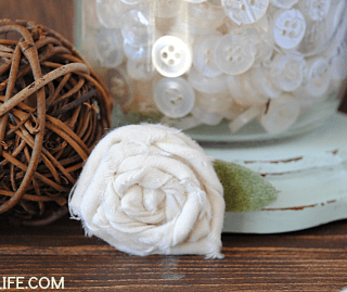 in front of jar of ivory buttons and wicker ballpretty, rustic decor!