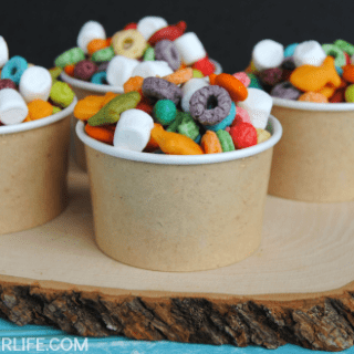 Make a fun snack mix with assorted rainbow colored tasty treats! This easy colorful Rainbow Snack Mix is perfect for St. Patricks Day!