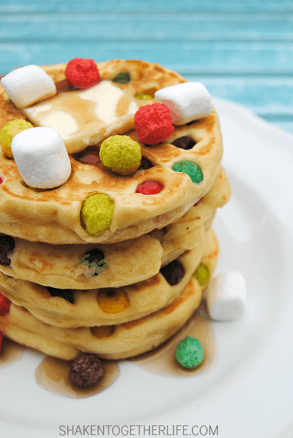Rainbow Polka Dot Pancakes! Fruity rainbow cereal added to pancakes makes a delicious whimsical breakfast treat!