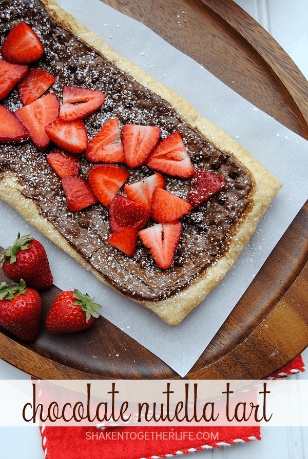 Golden puff pastry gets a warm melty layer of Nutella and chocolate chips, topped with fresh sliced strawberries and then sprinkled with powdered sugar. Oh my gosh, this looks amazing!