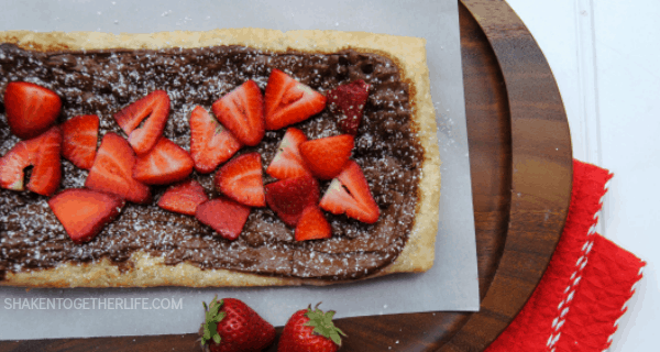 Golden puff pastry gets a warm melty layer of Nutella and chocolate chips, topped with fresh sliced strawberries and then sprinkled with powdered sugar.  Oh my gosh, this looks amazing!