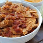 shredded Mexican chicken in white bowl