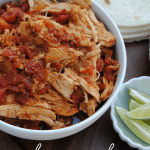 Slow Cooker Shredded Chicken is a staple in our house for easy meals! The flavorful, tender chicken is perfect for tacos, nachos, burritos and taco salads!