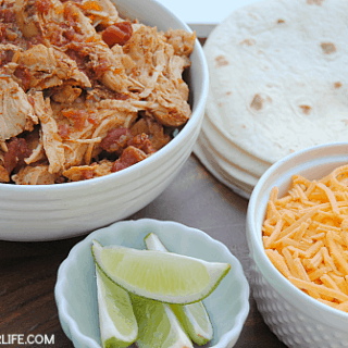 Slow Cooker Shredded Chicken is a staple in our house for easy meals! The flavorful, tender chicken is perfect for tacos, nachos, burritos and taco salads!