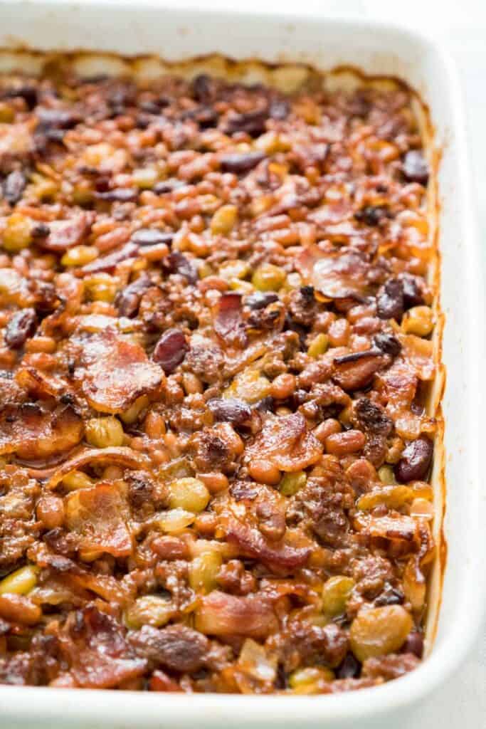 calico beans baked beans in white baking dish