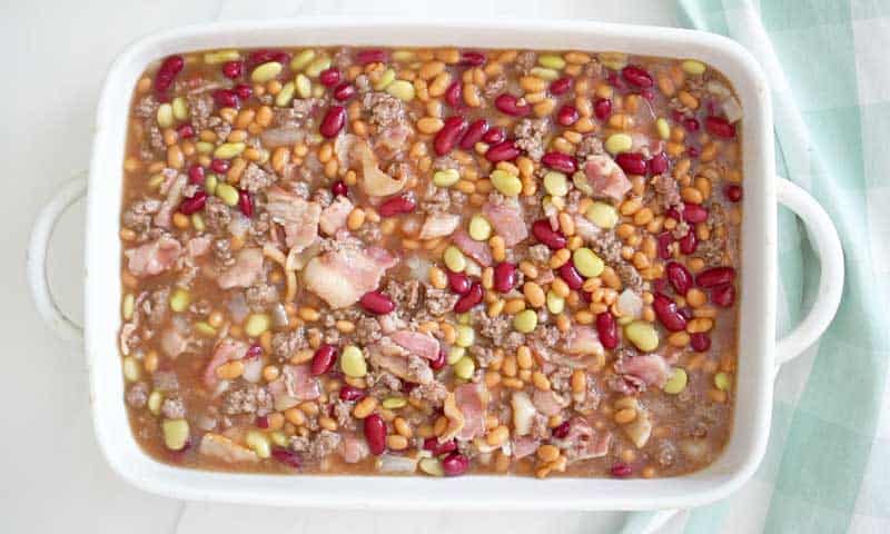 calico beans baked beans in white baking dish