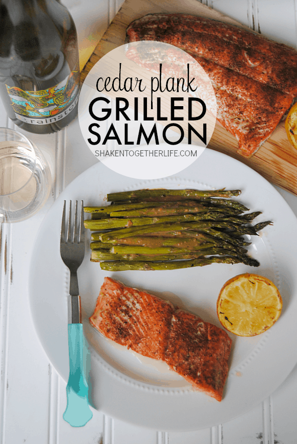 Cedar Plank Grilled Salmon - so much easier than we thought! Grilled until tender and flaky, this salmon is perfectly paired with grilled lemons, asparagus and Rainstorm Wine!