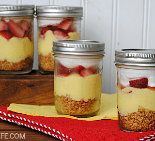 Lemon Berry Pudding Parfaits with layers of graham crackers, pudding, fresh berries and fluffy whipped topping are a lightened up Summer dessert!