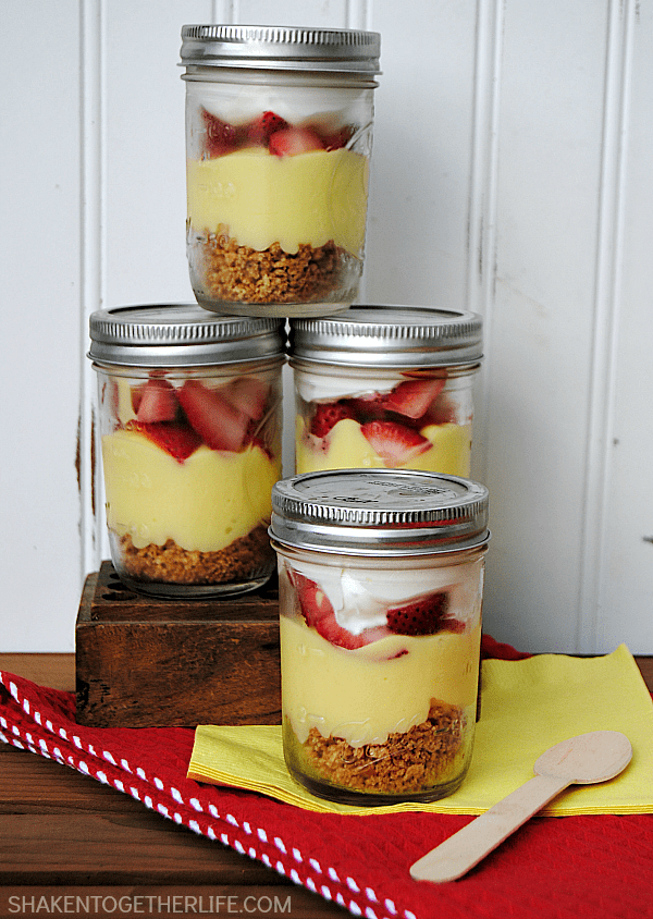 Lemon Berry Pudding Parfaits with layers of graham crackers, pudding, fresh berries and fluffy whipped topping are a lightened up Summer dessert!