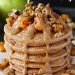 stack of pancakes with apples and syrup