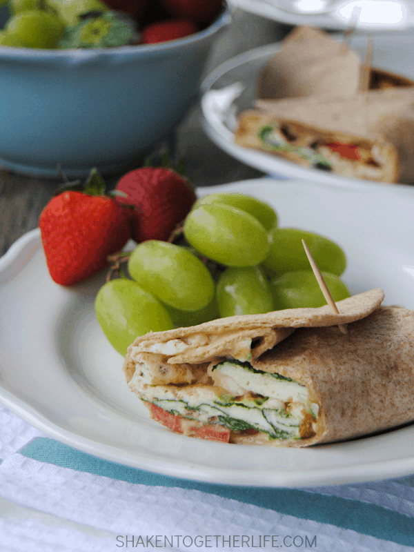 Mediterranean breakfast wraps are a healthy way to start the day! Packed with egg whites, spinach, tomatoes, feta and even hummus, this wrap is protein packed and hearty enough for brunch or lunch, too!
