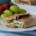 Mediterranean breakfast wraps are a healthy way to start the day! Packed with egg whites, spinach, tomatoes, feta and even hummus, this wrap is protein packed and hearty enough for brunch or lunch, too!