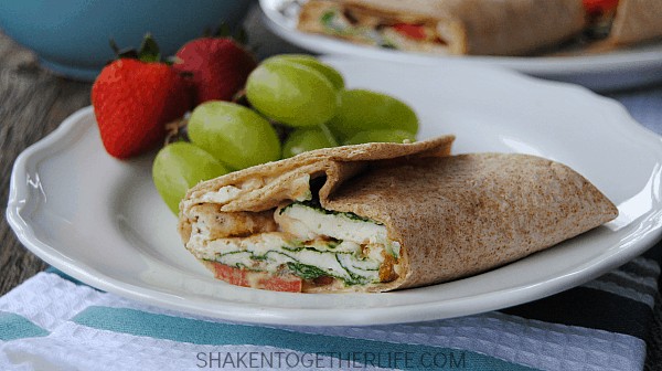 Mediterranean breakfast wraps are a healthy way to start the day! Packed with egg whites, spinach, tomatoes, feta and even hummus, this wrap is protein packed and hearty enough for brunch or lunch, too!