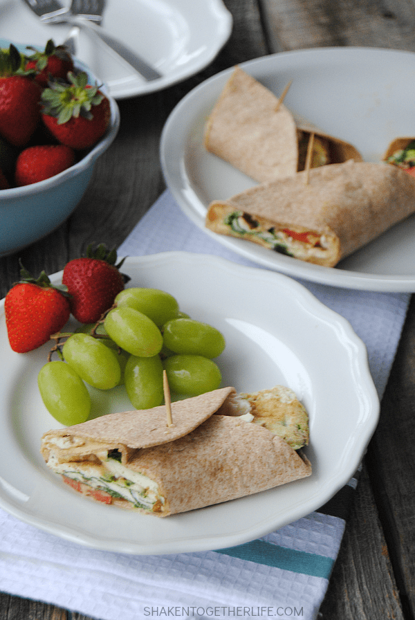 Mediterranean breakfast wraps are a healthy way to start the day! Packed with egg whites, spinach, tomatoes, feta and even hummus, this wrap is protein packed and hearty enough for brunch or lunch, too!