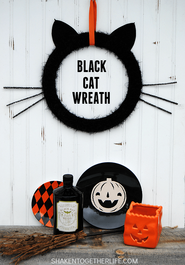 Give your front door or mantel a touch of frightfully furry fun with this easy Black Cat Wreath!