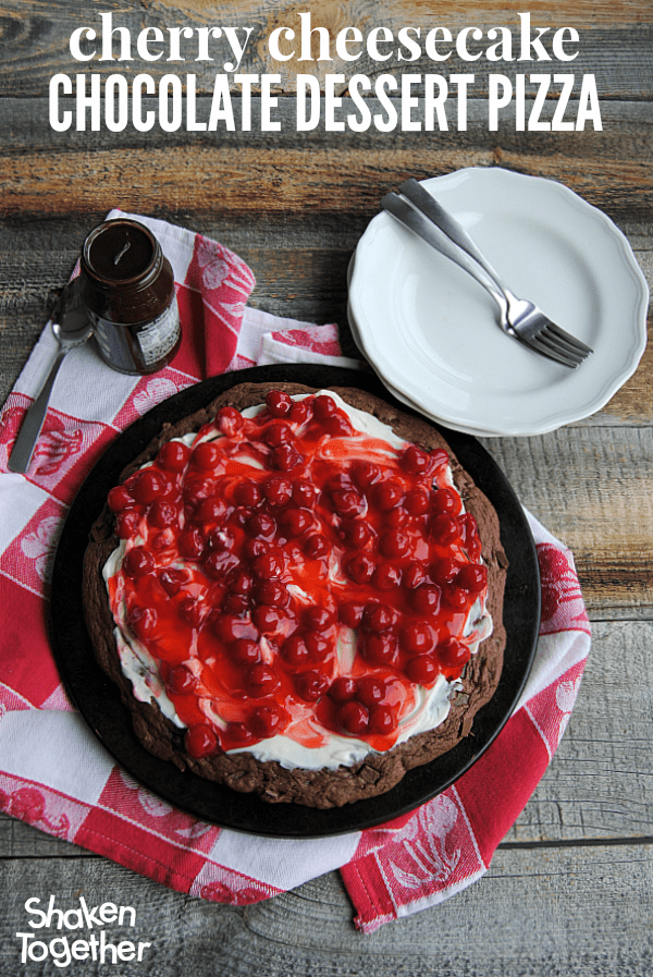 With a double chocolate cookie crust, a sweet cheesecake spread, tart cherries and a drizzle of warm hot fudge, this Cherry Cheesecake Chocolate Dessert Pizza is dessert perfection!