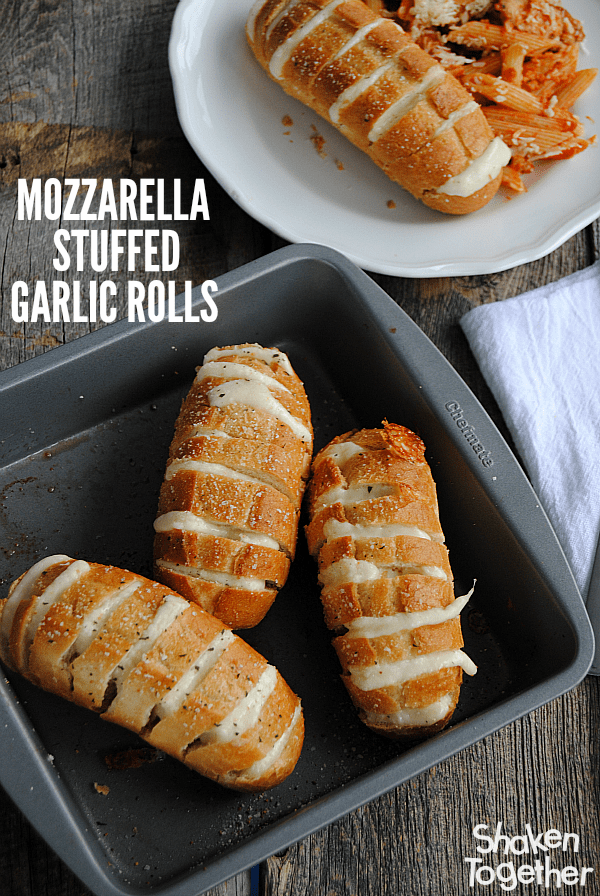 Mozzarella Stuffed Garlic Rolls are a quick and easy side dish! Our family loved to pull apart these ooey gooey cheesy rolls!