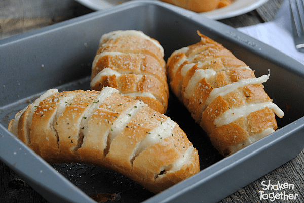 Mozzarella Stuffed Garlic Rolls are a quick and easy side dish! Our family loved to pull apart these ooey gooey cheesy rolls!