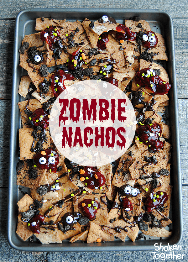 Looking for an easy dessert for Halloween or The Walking Dead party?! Make these sweet, no bake Zombie Nachos! These dessert nachos are layered with all sorts of sweet treats and are dreadfully delicious!