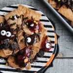 Looking for an easy dessert for Halloween or The Walking Dead party?! Make these sweet, no bake Zombie Nachos! These dessert nachos are layered with all sorts of sweet treats and are dreadfully delicious!