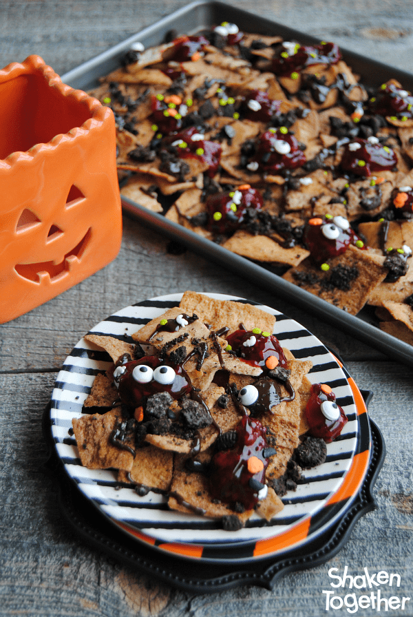 Looking for an easy dessert for Halloween or The Walking Dead party?! Make these sweet, no bake Zombie Nachos! These dessert nachos are layered with all sorts of sweet treats and are dreadfully delicious!