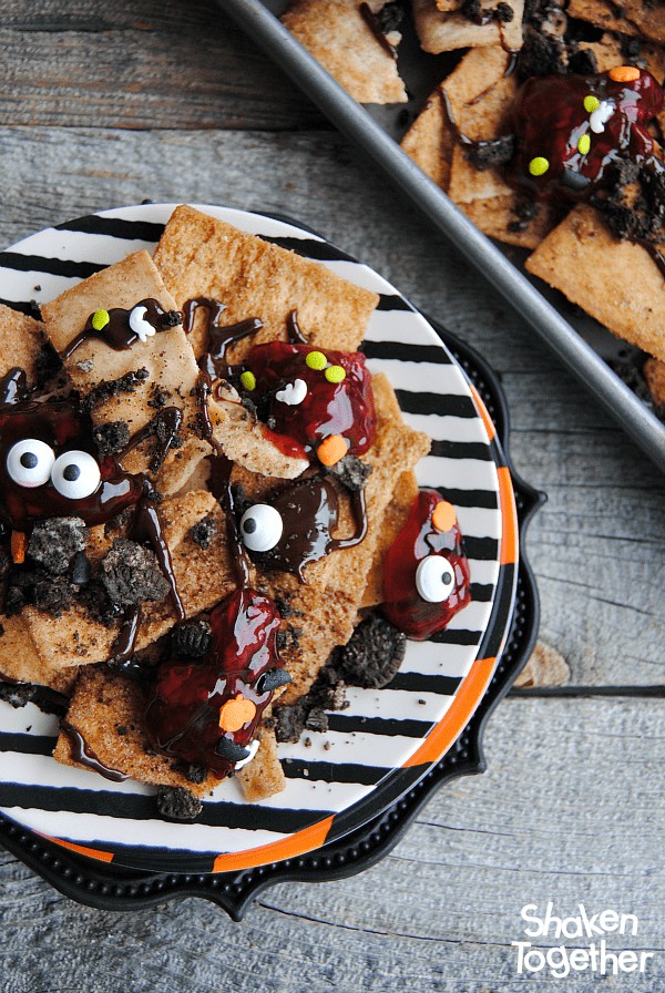 Looking for an easy dessert for Halloween or The Walking Dead party?! Make these sweet, no bake Zombie Nachos! These dessert nachos are layered with all sorts of sweet treats and are dreadfully delicious!