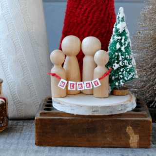I cannot handle the cuteness of this Mini Christmas Wooden Family! LOVE the bottle brush tree and teeny tiny banner! These would make awesome Christmas gifts!
