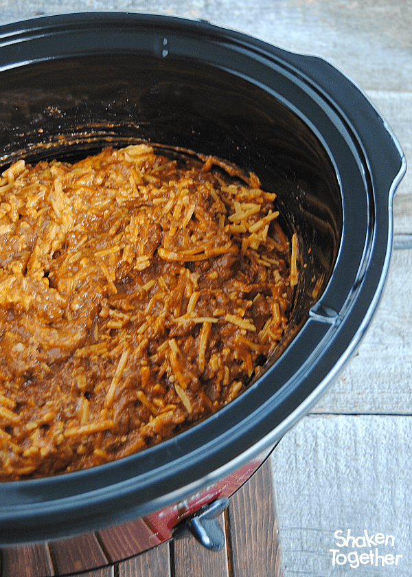 Crock Pot Chili Cheese Dip - so creamy and delicious poured over nachos, hot dogs, fries or baked potatoes!