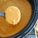 Crock Pot Chili Cheese Dip - so creamy and delicious poured over nachos, hot dogs, fries or baked potatoes!