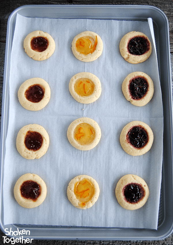 I love how the jam gets all glossy and gorgeous as these Jam Thumbprint Cookies bake!