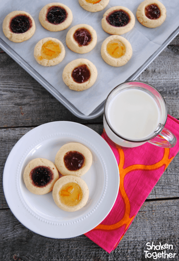 Soft buttery sugar cookies filled with your favorite fruity jam - these might be the easiest Jam Thumbprint Cookies ever!