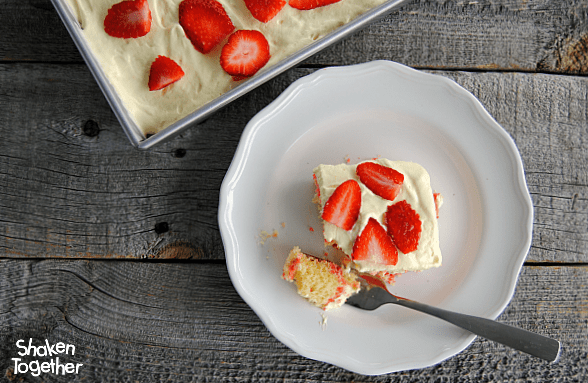 Lemon Strawberry Poke Cake on a white plate