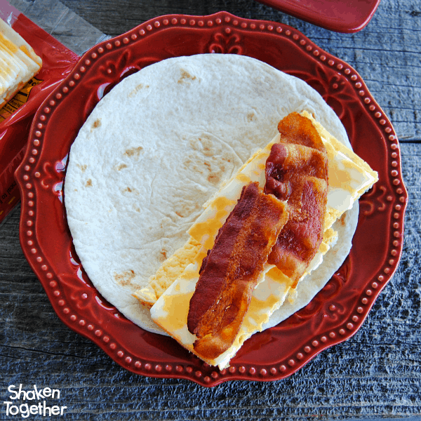 Add crispy bacon (or your favorite breakfast meat) as the final layer for our Breakfast Soft Tacos!