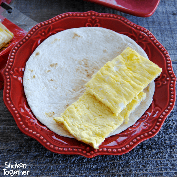 Make a pan of sheet pans eggs to make the assembly of these Breakfast Soft Tacos easy!