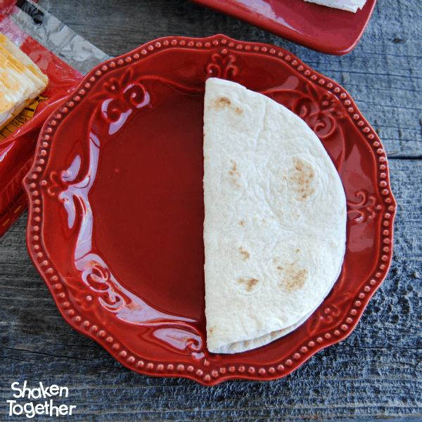 Fold tortillas in half to making stuffing your Breakfast Soft Tacos a little easier!