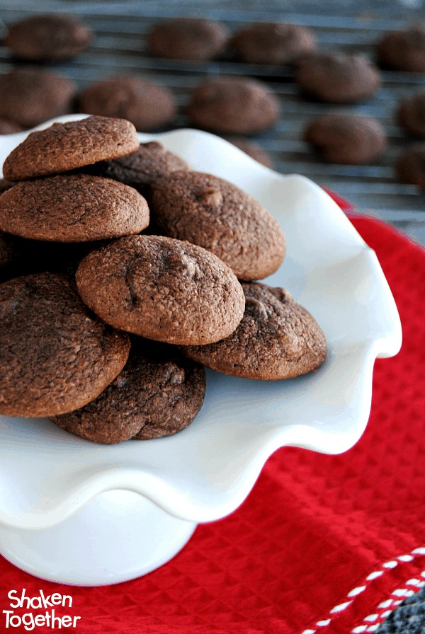 stack of brownie mix cookies on white platter