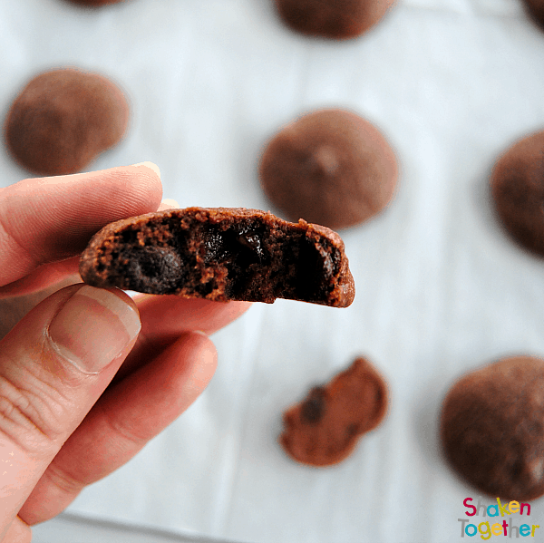 Just look at the soft, chocolately inside of these super easy Two Bite Brownie Cookies! All you need to do is add a few ingredients to a boxed brownie mix!