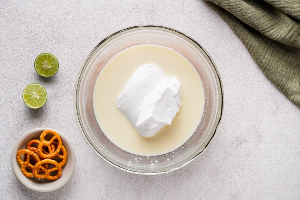 whipped cream and pudding mix in glass bowl