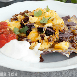 Start the Cinco de Mayo fiesta early with a big tray of our Breakfast Nachos! Loaded with cheese, scrambled eggs and chorizo, we love to top the with salsa and Mexican creama!