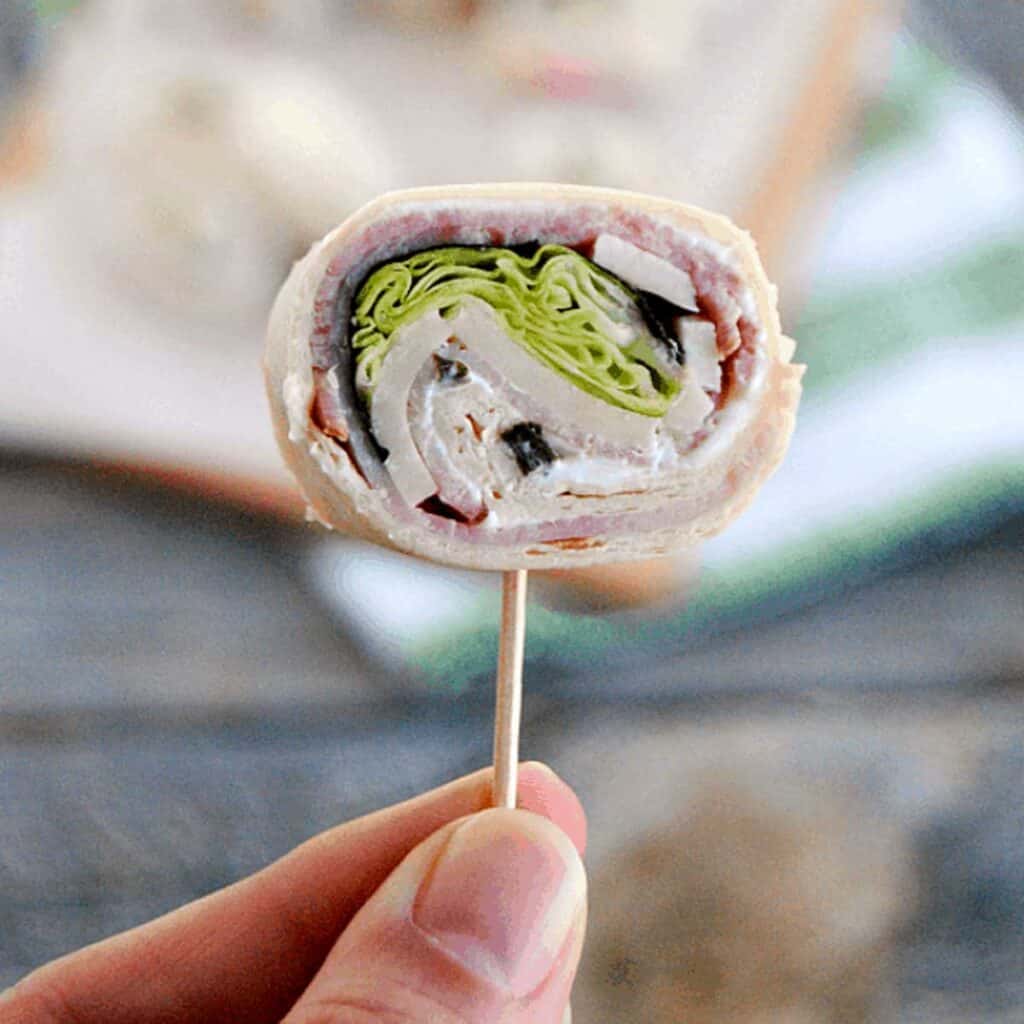 ham and cheese roll up on a toothpick