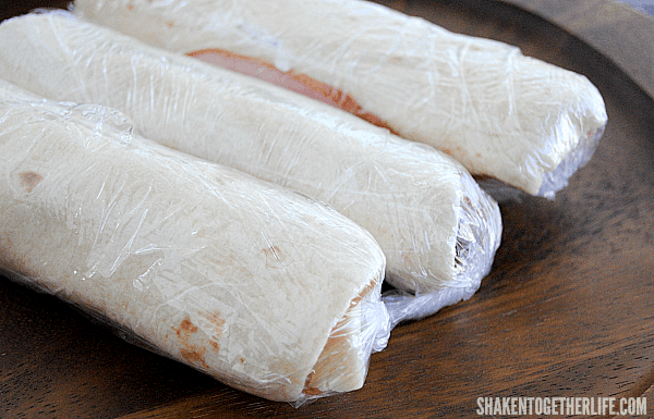 Wrap the Ham & Cheese Roll Ups in plastic wrap and refrigerate for an hour to make slicing them so much easier!