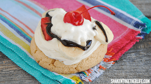 Top fresh bakery cookies with frosting, fruit and fudge for a twist on a banana split - Banana Split Cookies!! Don't forget the whipped cream and cherry on top!
