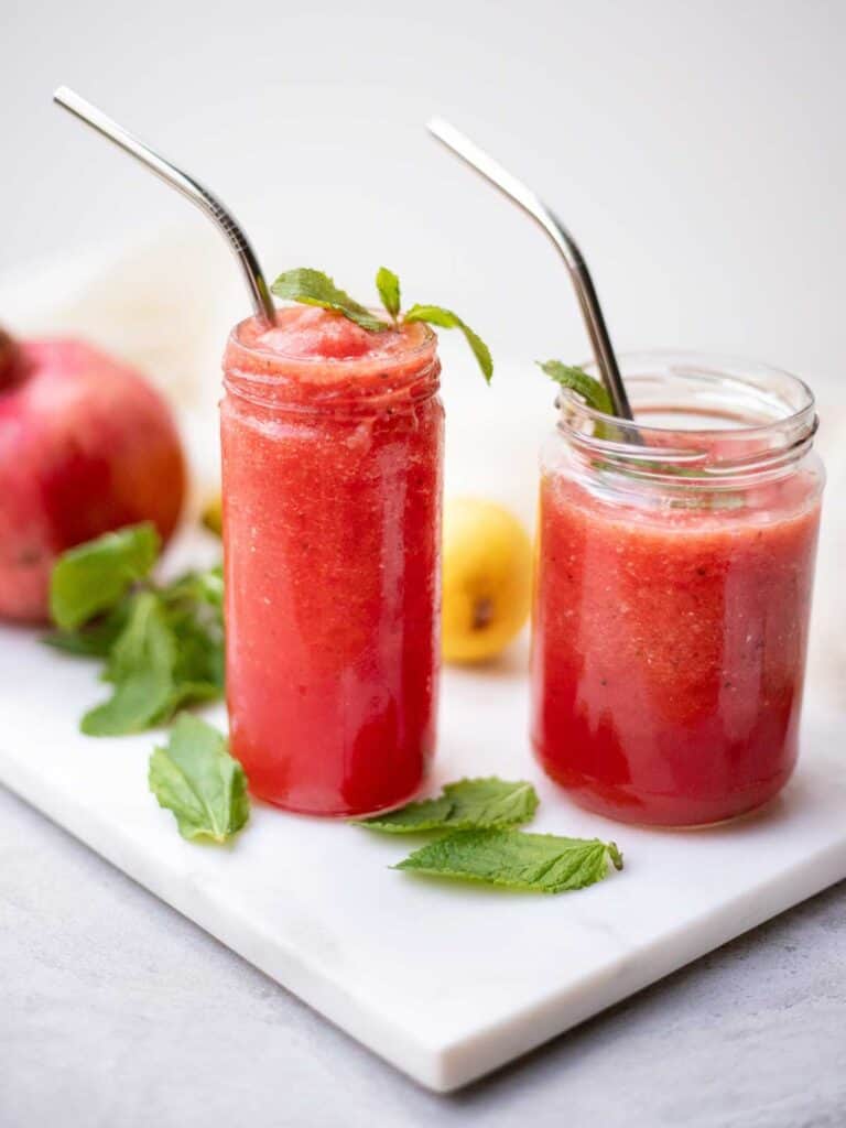 two glasses of pink fruit slushie