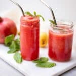 two glasses of pink fruit slushie