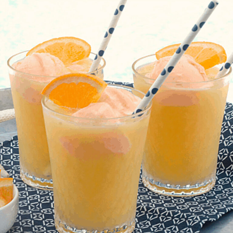 three glasses of orange sherbet punch